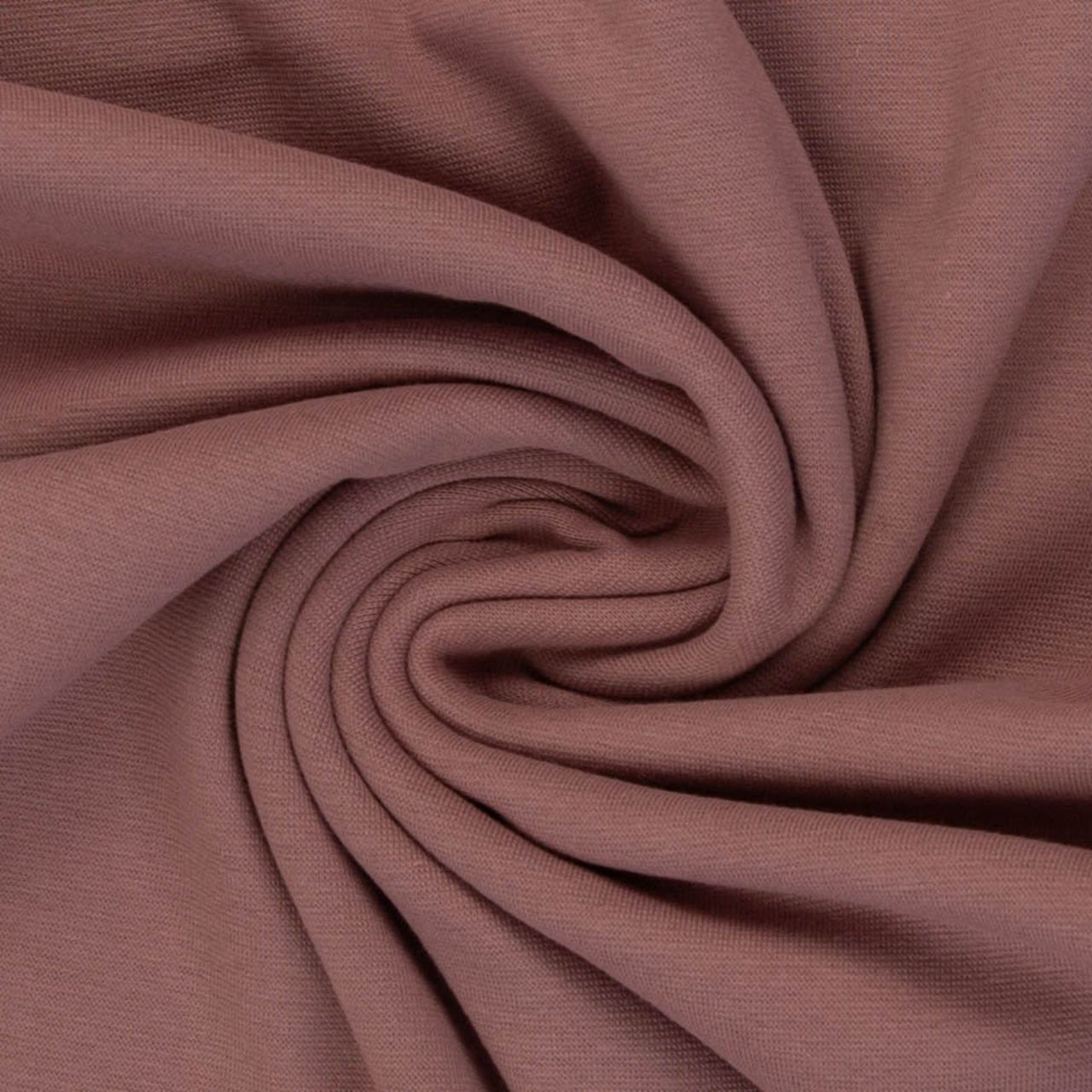 Hnědá látka s točením ve středu