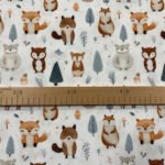 Látka s lesními zvířaty a pravítkem