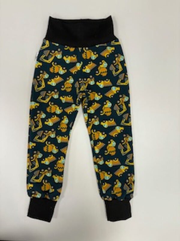 Dětské kalhoty s potiskem zvířátek na tmavém pozadí.