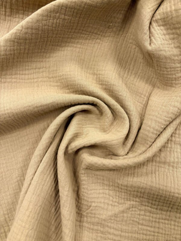 Béžová textilie, měkký materiál, vlnitý povrch