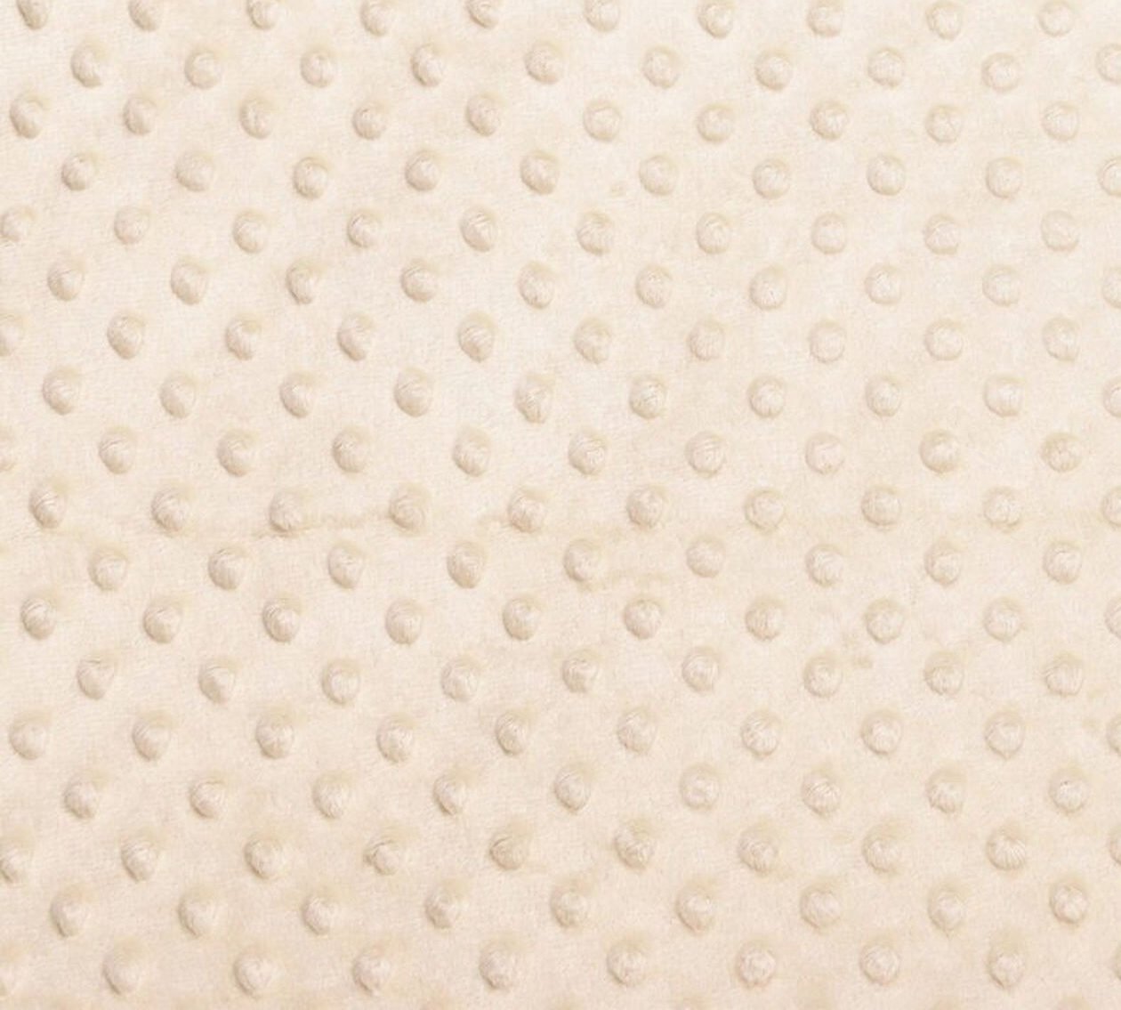 Béžová látka s vystouplými tečkami