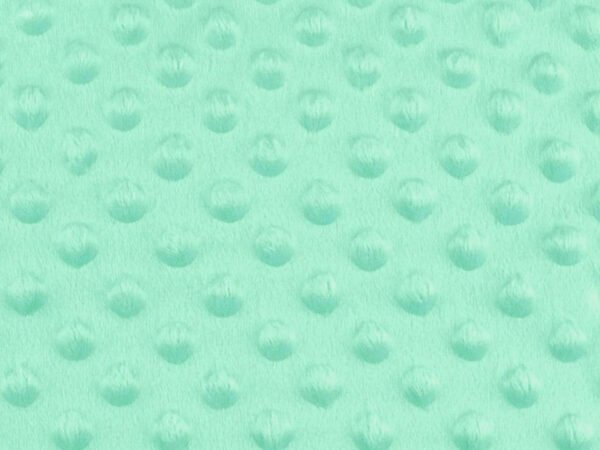 Mentolově barevná textura s vyvýšenými body.