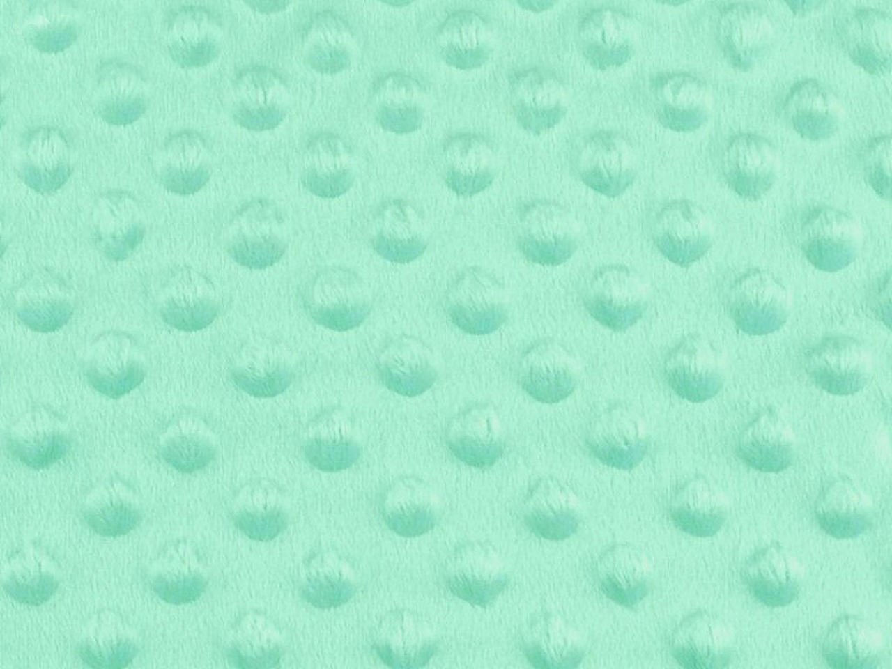 Mentolově barevná textura s vyvýšenými body.