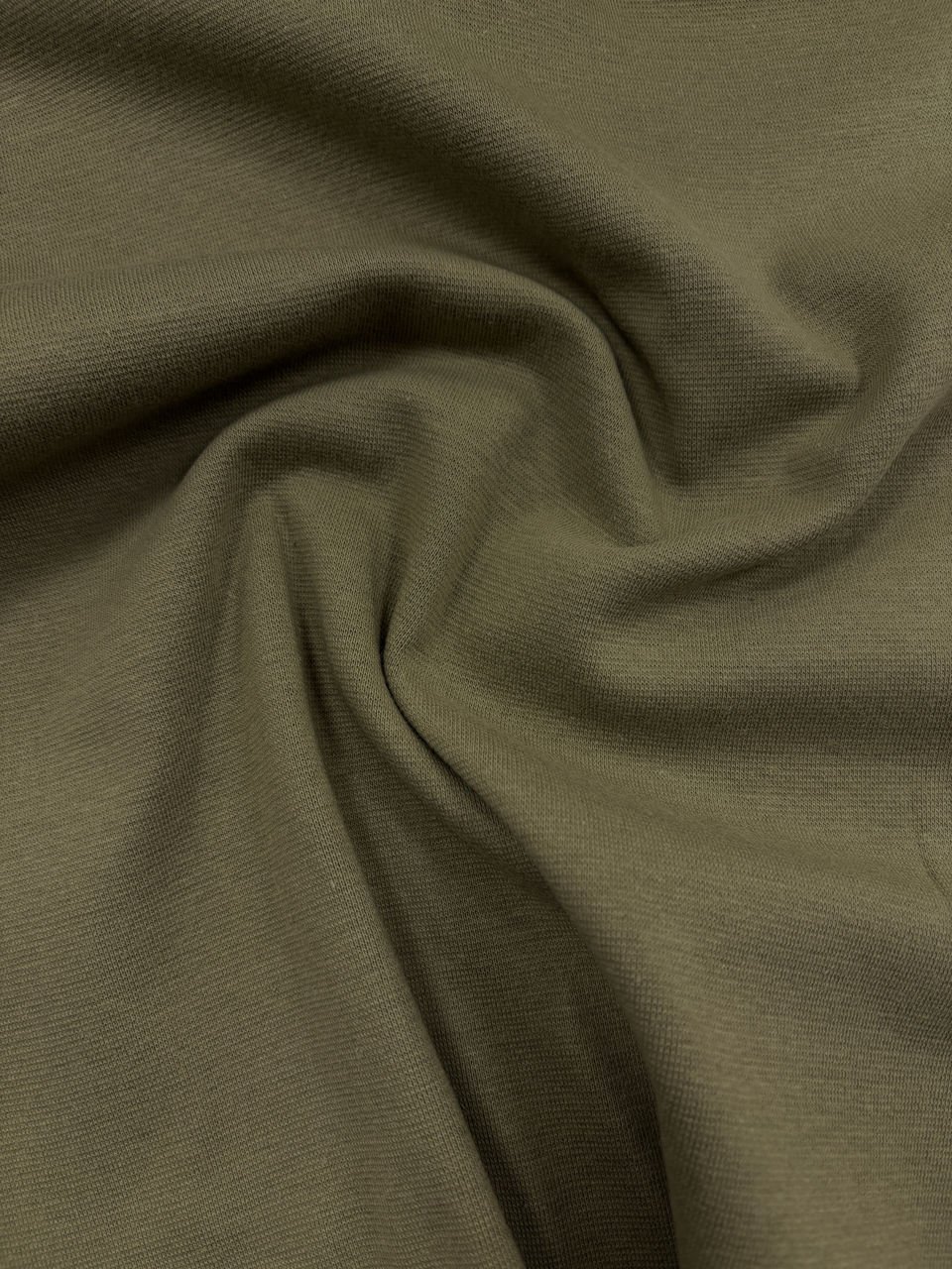 Detail látky v olivové barvě