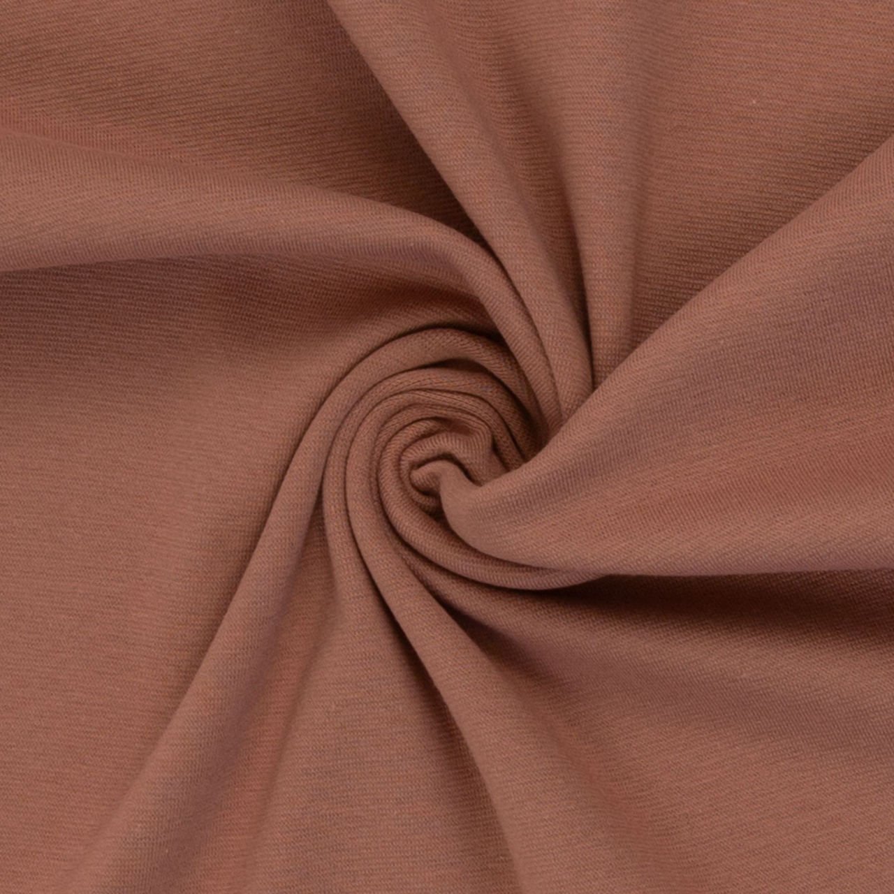 Detail hnědé látky srážené ve spirále