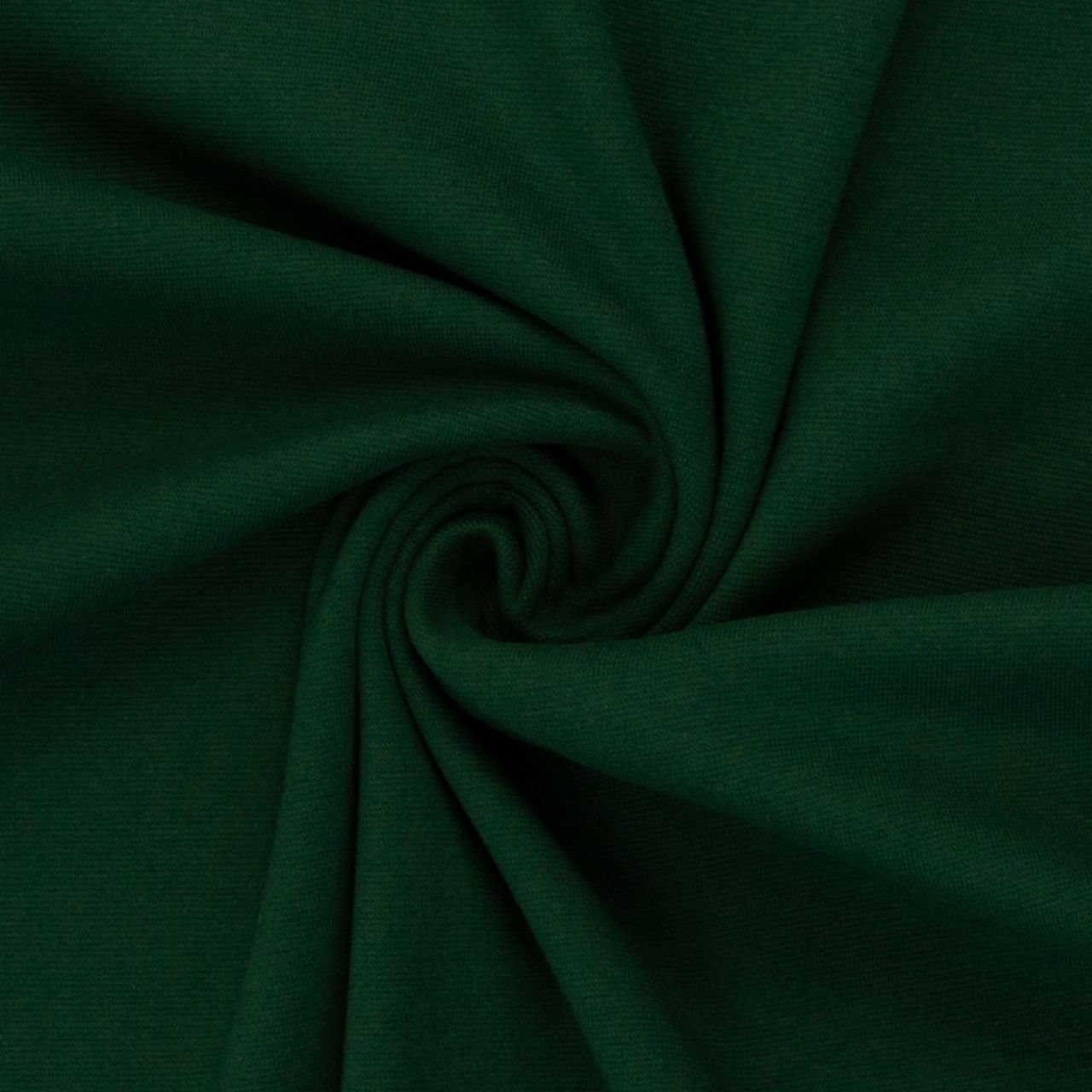 Zelená látka smotanově srolovaná do spirály.