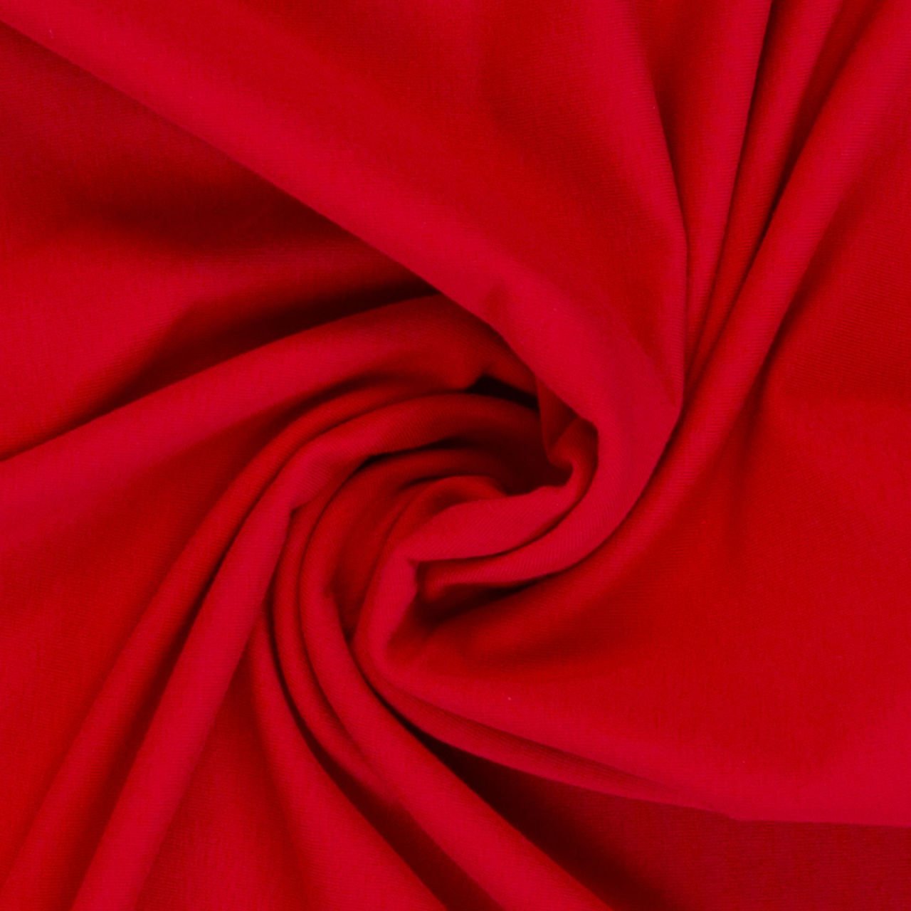 Červená tkanina spirálovitě složená